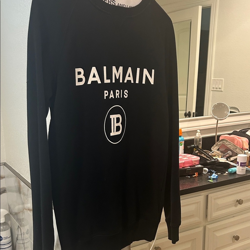 Balmain Black Crewneck Sweater women XS covers your bum.